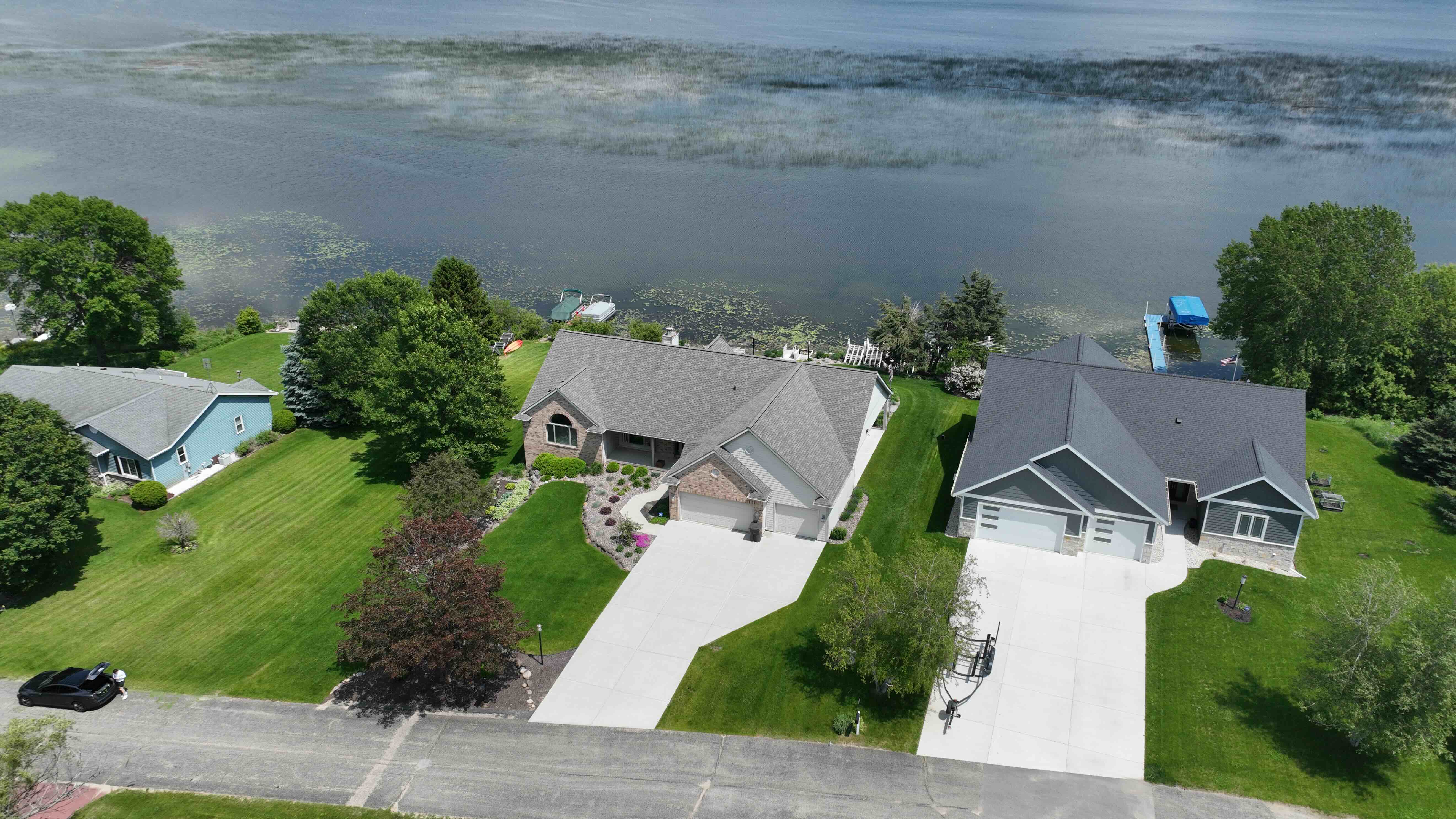 Aerial view of central Iowa suburban homes with well-maintained roofs and gutters